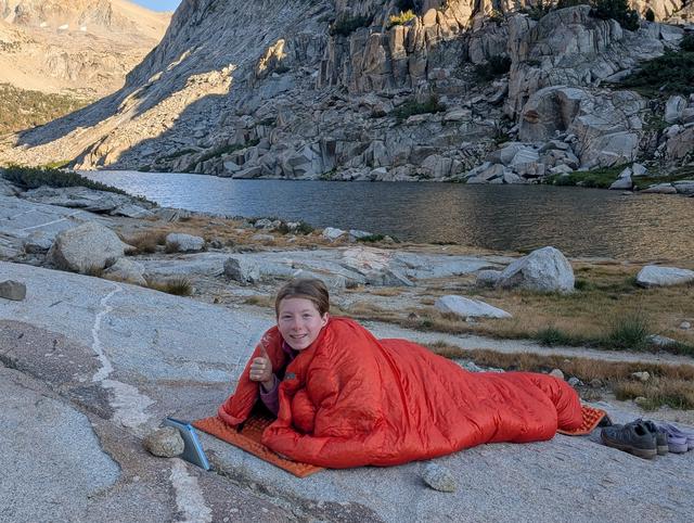 At Palisade Lakes: Maya reads from her kindle next